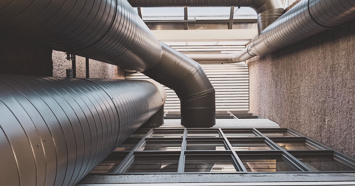 Industrial HVAC chillers and air handling units on a commercial rooftop in the UAE