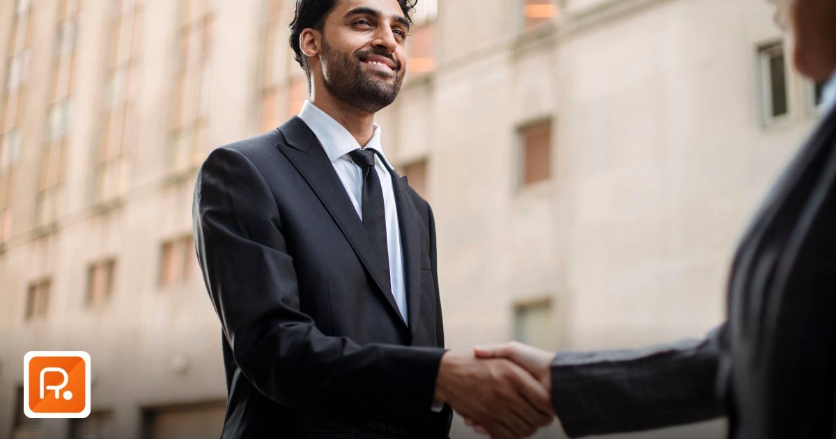 Distributor vs Wholesaler vs Manufacturer GCC: Who to Approach? - business professionals in suits shaking hands outdoors