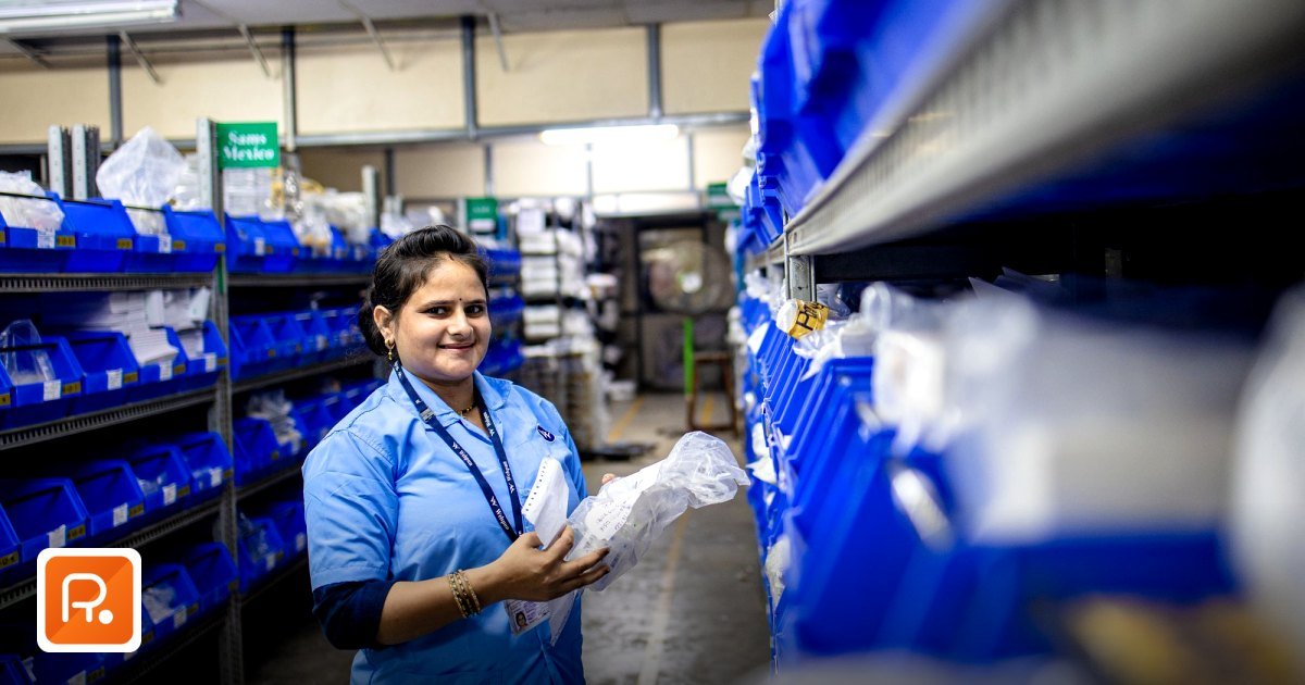 Top Eid Al Adha Corporate Gifting Ideas in Dubai for B2B Clients - smiling woman in a warehouse organizing inventory