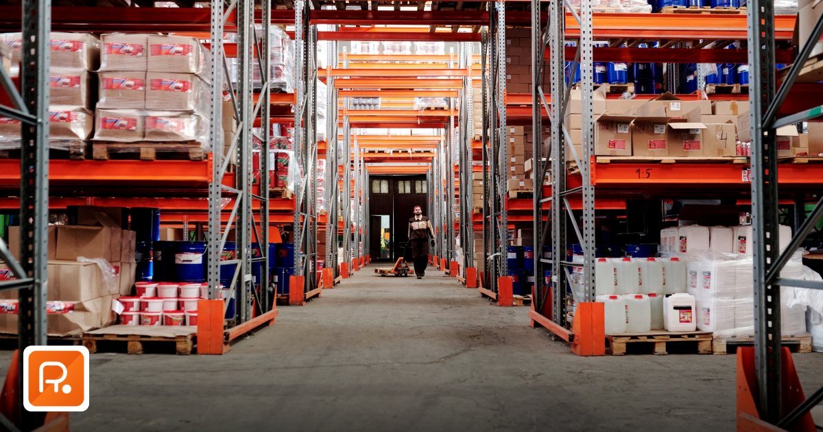 Top Eid Corporate Gifting Ideas in Dubai for B2B Partners & Staff - a spacious industrial warehouse with stocked shelves