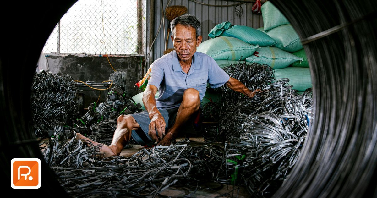 Electrical Materials & Cables Wholesale Suppliers UAE B2B 2026 - elderly man organizing electrical wires in a workshop,