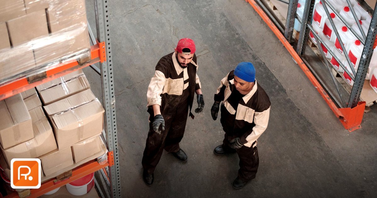 How does B2B procurement affect the supply chain in GCC? - two adult men in a warehouse communicating about storage