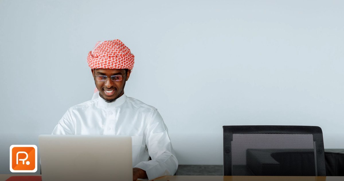 How Gulf Procurement Teams Are Sourcing Construction Materials in 2026 - middle man in traditional attire using a laptop
