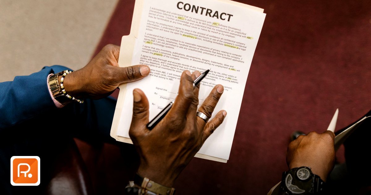 How Many Quotes Should I Get Before Awarding a Purchase Order? - two businessmen reviewing and signing a contract document