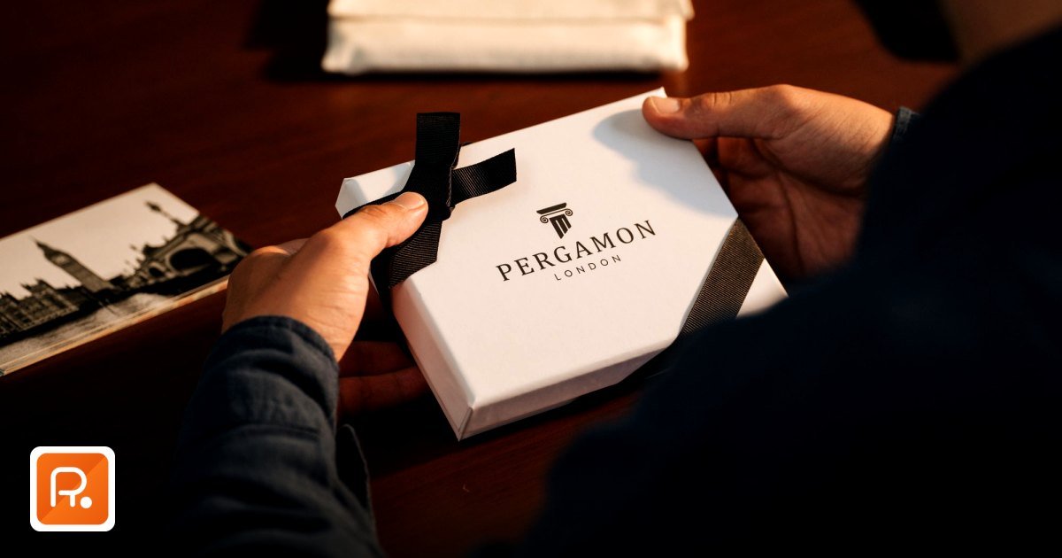 Building a Resilient Corporate Gift Supply Chain GCC in 2026 - hands holding a gift box on a wooden table