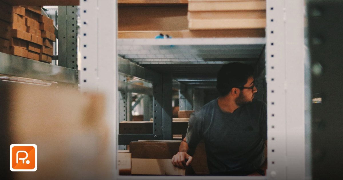 How to Verify Supplier UAE Trade License – A Practical Guide - woman in uniform organizing inventory in a warehouse aisle