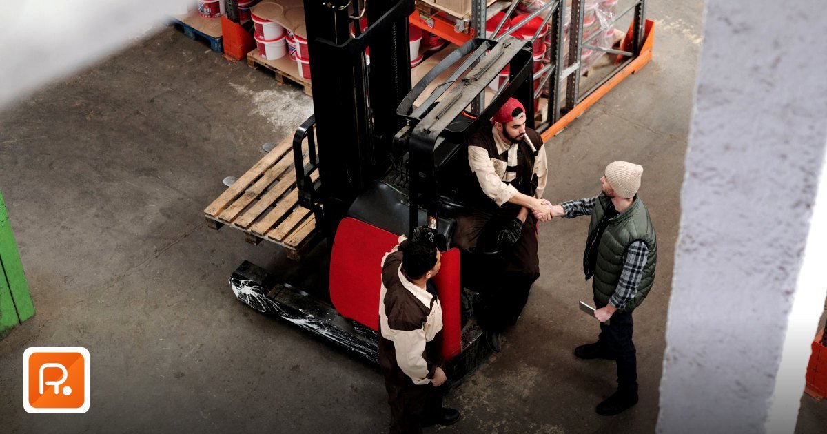Industrial Equipment Marketplace UAE & GCC: The B2B Buyer's Guide for 2026 - three warehouse workers in conversation