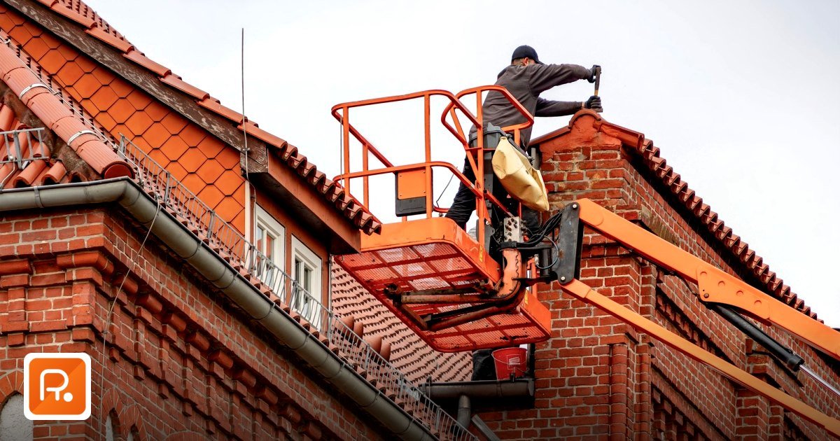 Roofing and Waterproofing Materials UAE 2026: B2B Wholesale Supplier Guide - roofer in a cherry picker conducting