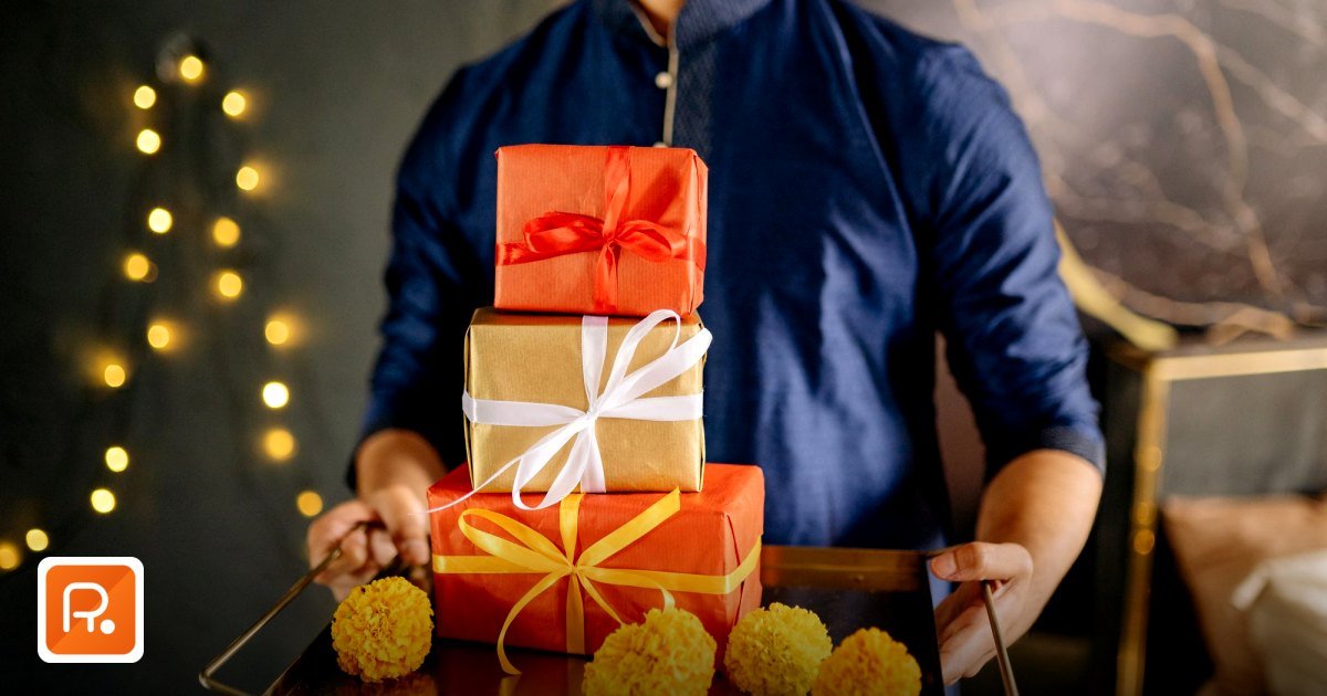 Hyper‑Personalized Corporate Gifts UAE: Trends & Supplier Networks - a man in traditional attire holding gifts with marigold