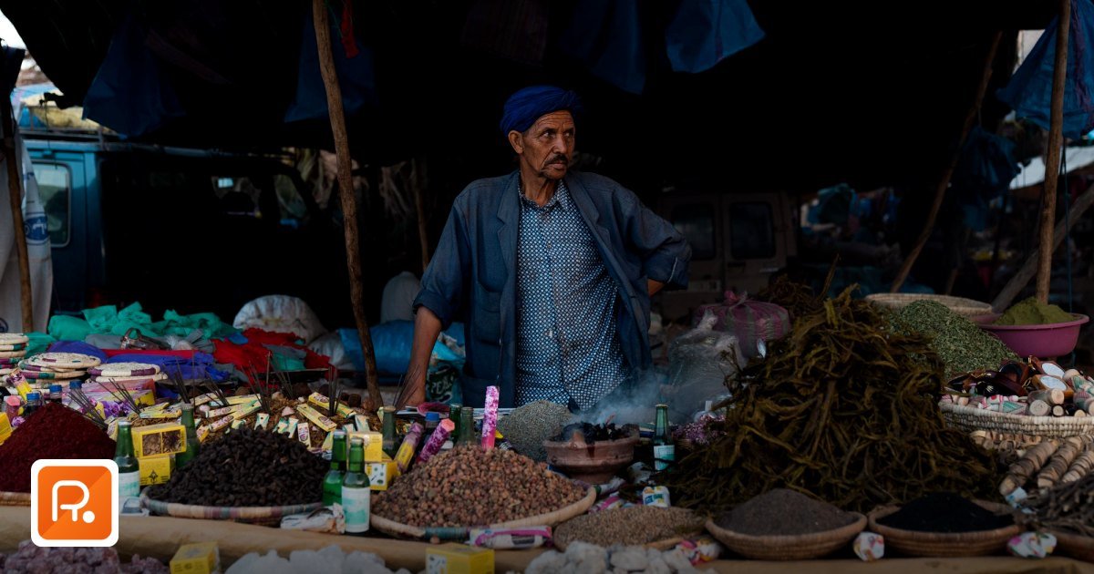 How to Write an RFQ for Suppliers in the GCC - middle-aged man in traditional attire selling spices at a vibrant outdoor