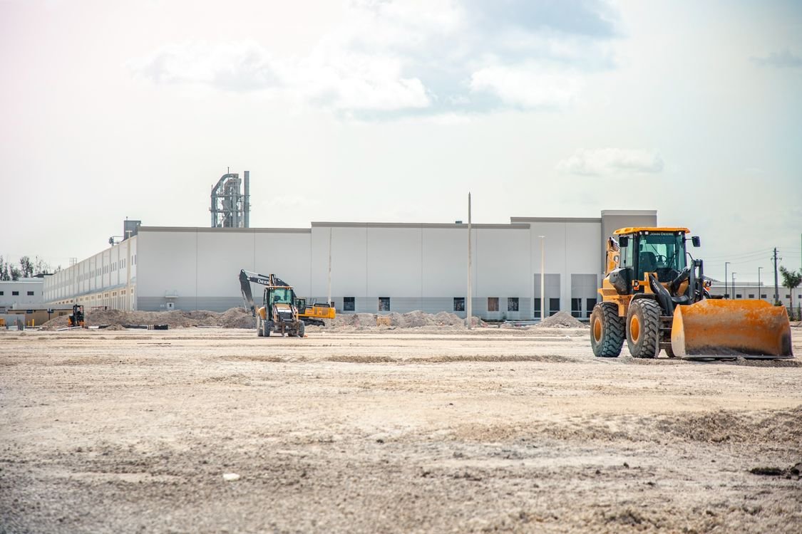 Industrial equipment warehouse in Dubai with heavy machinery and B2B procurement staff